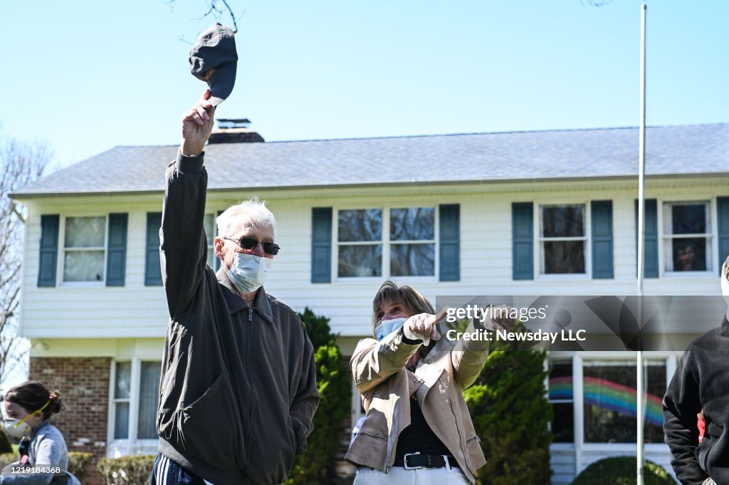 Man who beat coronavirus waves to neighbors after being released from hospital