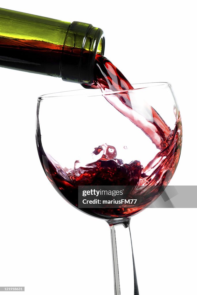 Close up of red wine being poured into a glass