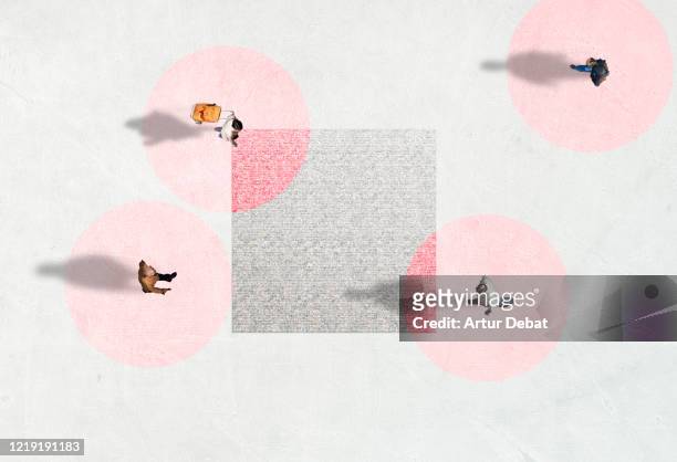 creative picture from above of people walking with social distancing and red circles. - four people stockfoto's en -beelden