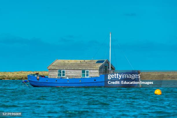 Houseboat near Blakeney Point on the North Norfolk Coast, East Anglia, England, UK.