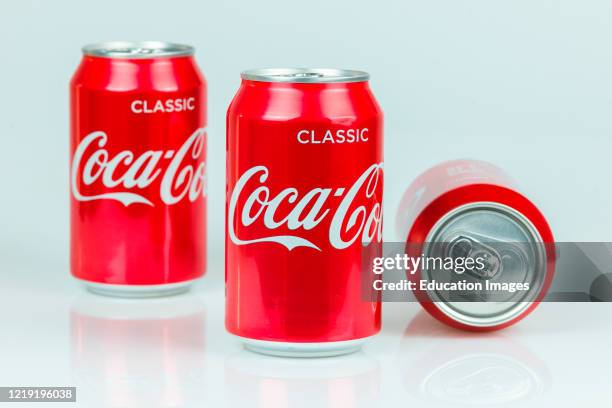 Classic Coke cans by Coca Cola isolated on white background.