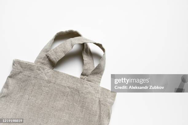 eco-bag made of linen and cotton on a white table. - bolso tote fotografías e imágenes de stock