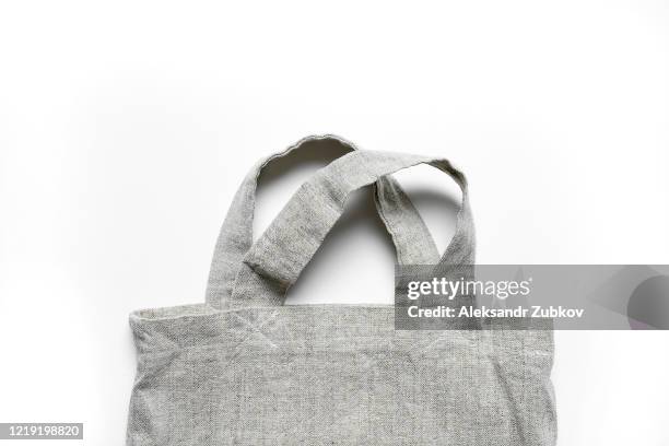 eco-bag made of linen and cotton on a white table. - green belt fashion item stock pictures, royalty-free photos & images