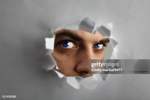 i see you! - man looking through keyhole - border ruffians stock pictures, royalty-free photos & images