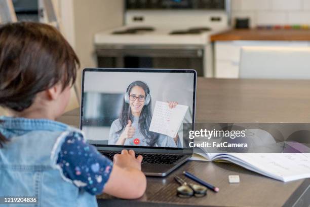 female student learning online from remote teacher - online coach stock pictures, royalty-free photos & images