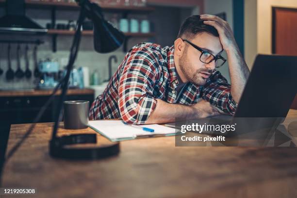 working through the business challenges - stressed man stock pictures, royalty-free photos & images