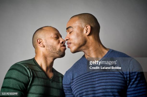 studio portraits of same sex male couple - black people kissing stock pictures, royalty-free photos & images