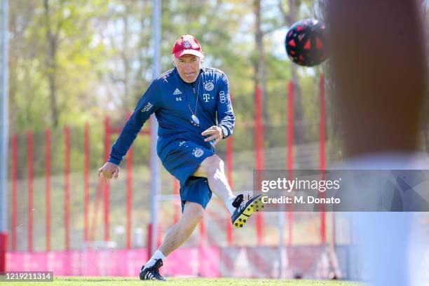 Assistant coach Hermann Gerland plays the ball during a soccer dart challenge as part of a training session at Saebener Strasse training ground on...