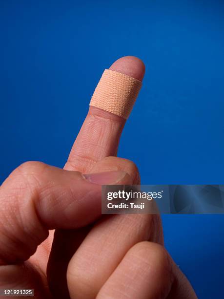 injured finger - bandaged thumb stock pictures, royalty-free photos & images