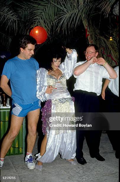 Steve James of England and Dennis Taylor of Northern Ireland relax during a break from the Dubai Duty Free Snooker Classic in Dubai, United Arab...