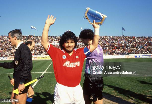 Diego Armando Maradona of SSC Napoli greets his fans before the Serie A match between Pescara Calcio and SSC Napoli at Stadio Adriatico , in Pescara,...