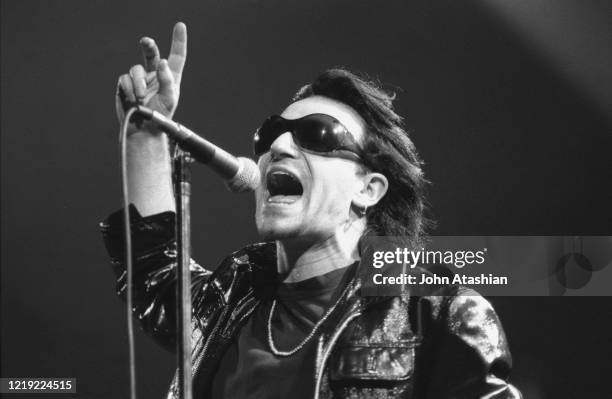 Singer Paul Hewson also, best known by his stage name Bono is shown performing on stage during a "live" concert appearance with U2 on March 13, 1992.
