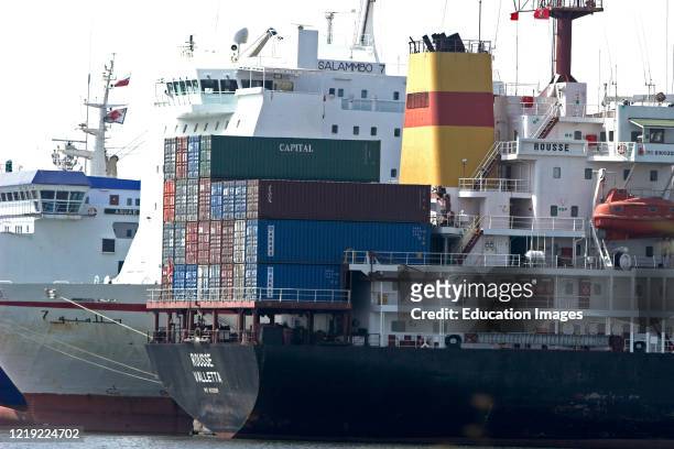Commercial container ship docked with others in port Tunis Tunisia.