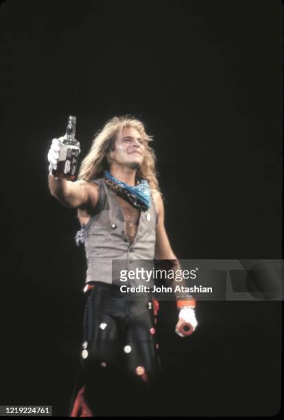 Singer David Lee Roth of the hard rock group Van Halen is shown performing on stage during a "live" concert appearance on March 7, 1984.