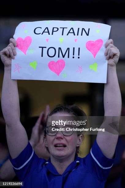 Nurse at Aintree University Hospital sheds a tear and as she pays tribute to super fundraiser Captain Tom Moore during the "Clap for Our Carers" and...
