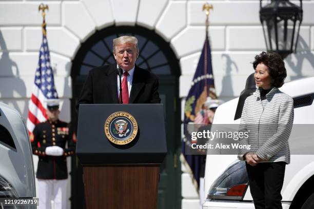 President Donald Trump speaks as Secretary of Transportation Elaine Chao listens during an event “celebrating America’s Truckers” at the South Lawn...