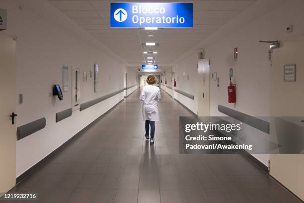 Staff member of the Hospital 'dell' Angelo' of Mestre walks along an empty corridor, for security reasons, on April 16, 2020 in Venice, Italy. The...