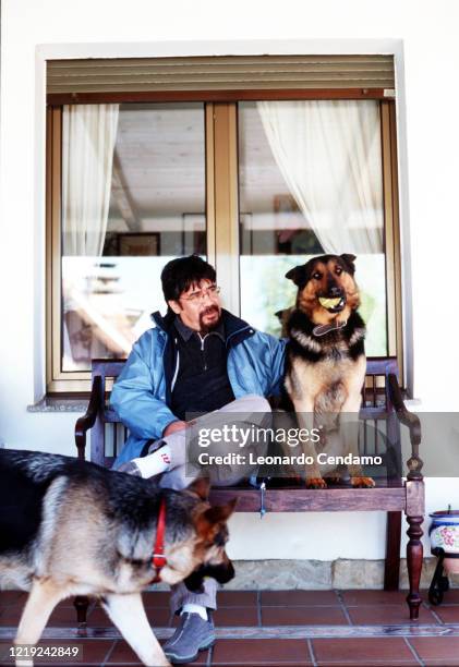 Chilean writer Luis Sepulveda with two dogs, Gijon, 11th April 2003.