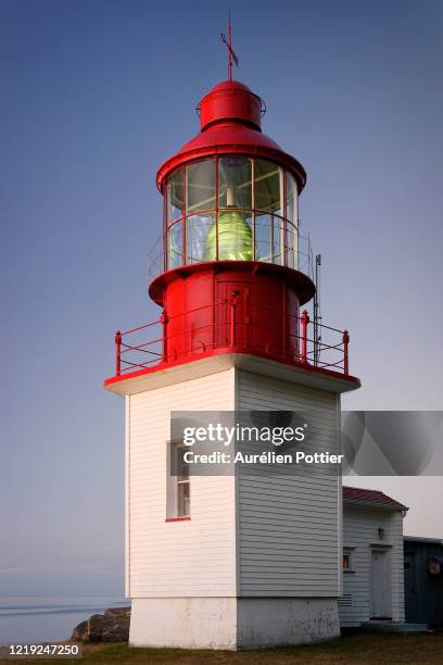 cap-chat, the lighthouse at dusk - gaspe peninsula stock pictures, royalty-free photos & images