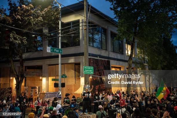 Band plays a free show in front of the Seattle Police Departments East Precinct in the so-called "Capitol Hill Autonomous Zone" on June 10, 2020 in...