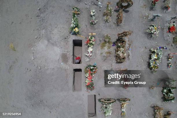 Aerial view from a drone of open graves dug to bury victims of the COVID-19 pandemic, at the Chalco Municipality Cemetery, Mexico registers more than...