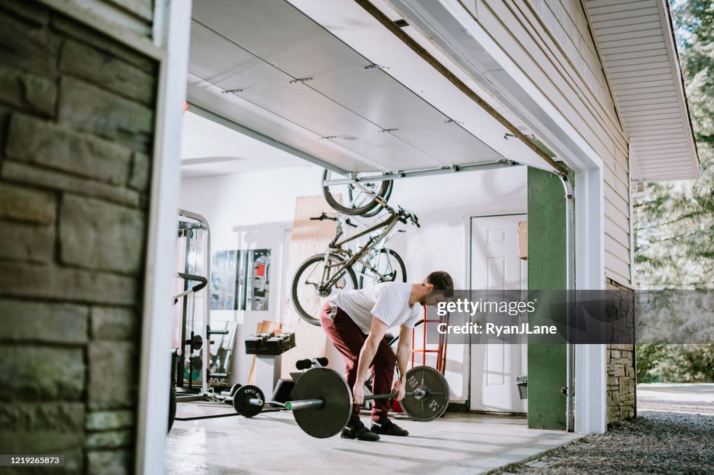 Man Doing Exercise Workout in Garage