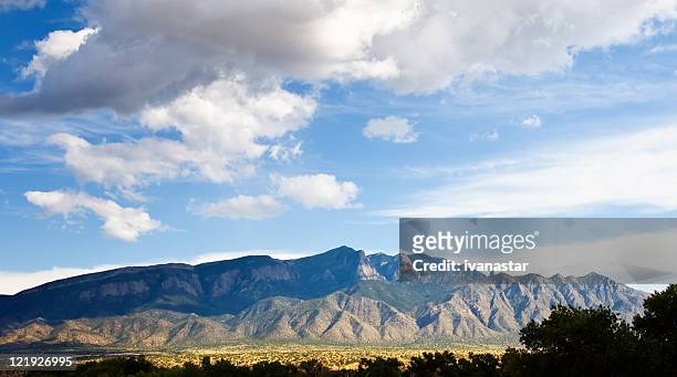 southwestern landscape with sandia mountains - mountain view stock pictures, royalty-free photos & images