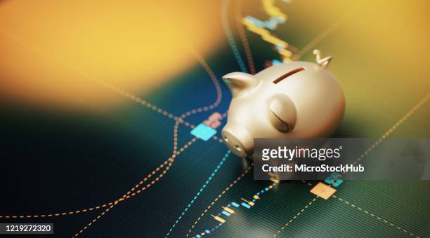 gold colored piggy bank sitting over a bar graph - savings concept - orçamento imagens e fotografias de stock