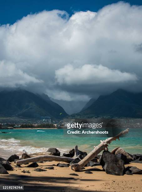 cruise ship parked in kahului harbor in front of iao valley with clouds and sandy beach - kahului maui stock pictures, royalty-free photos & images