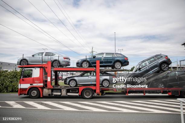 New Skoda Superb hybrid automobiles sit on a vehicle transporter outside the Skoda Auto AS plant, operated by Volkswagen AG, in Kvasiny, Czech...