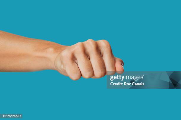 white fist - grabbed stock pictures, royalty-free photos & images