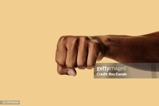 black fist - punching stock pictures, royalty-free photos & images