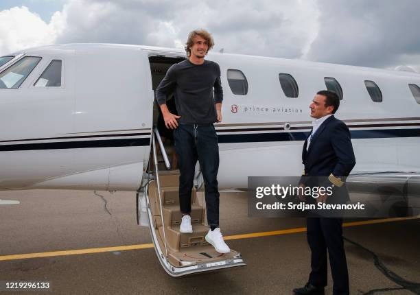 German tennis player Alexander Zverev exits the airplane upon his arrival at the Nikola Tesla airport on June 11, 2020 in Belgrade, Serbia. Adria...