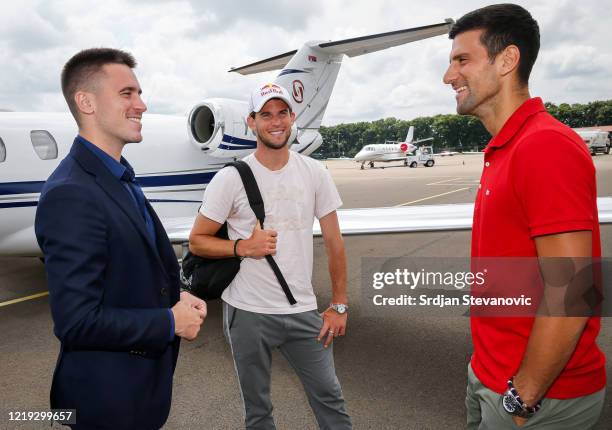 Djordje Djokovic Dominic Thiem and Novak Djokovic talk after Thiems arrival at the Nikola Tesla airport on June 11, 2020 in Belgrade, Serbia. Adria...