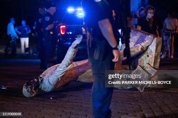 Statue of Confederate States President Jefferson Davis lies on the street after protesters pulled it down in Richmond, Virginia, on June 10, 2020. -...