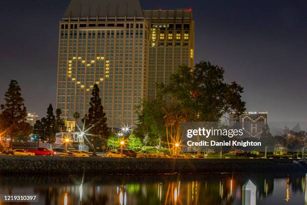 General view of heart shaped lights at Manchester Grand Hyatt and Hilton Bayfront hotels on April 16, 2020 in Various Cities, United States....