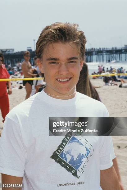 American actor Chad Allen wearing a t-shirt with the logo of 'Earth Day 1990' in Los Angeles, California, 1990.