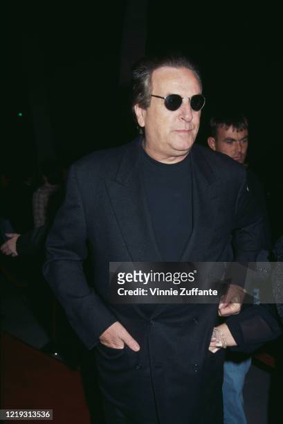 American actor Danny Aiello wearing a black suit with a black crew-neck shirt and sunglasses at the premiere of 'The Professional', held at the...