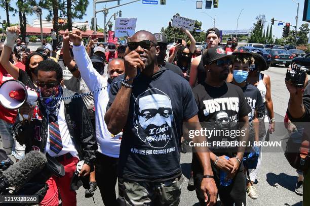 Former NFL wide receiver Terrell Owens leads a protest march in support of quarterback Colin Kaepernick in Inglewood, California on June 11, 2020....