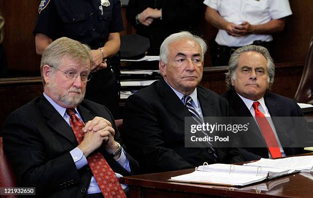 Former International Monetary Fund director Dominique Strauss-Kahn appears before a judge with his lawyers lawyers, William Taylor and Benjamin...