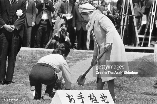 Empress Nagako plants a young tree during the 22nd National Tree Planting Festival at Mt. Sanbe on April 18, 1971 in Oda, Shimane, Japan.