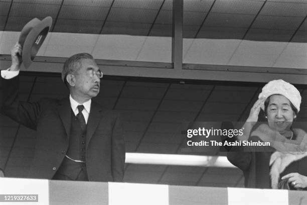Emperor Hirohito and Empress Nagako wave to well-wishers from a balcony of the Oda Civic Hall on April 19, 1971 in Oda, Shimane, Japan.