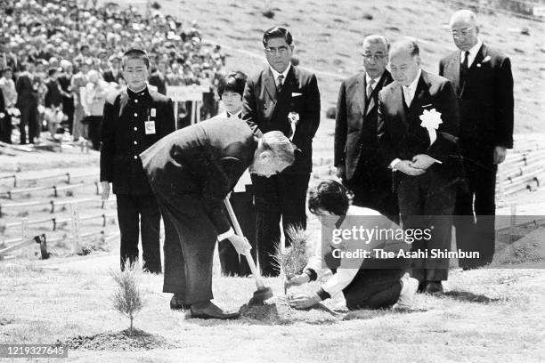 Emperor Hirohito plants a young tree during the 22nd National Tree Planting Festival at Mt. Sanbe on April 18, 1971 in Oda, Shimane, Japan.