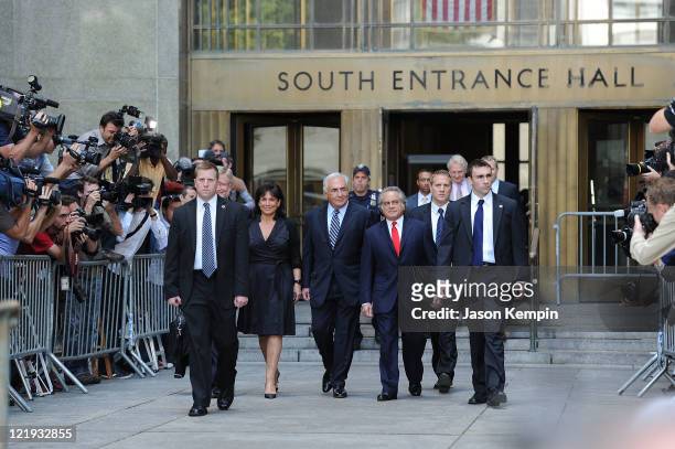 Anne Sinclair, Dominique Strauss-Kahn and lawyer Benjamin Brafman leave Manhattan Criminal Court after attending a status hearing on the sexual...