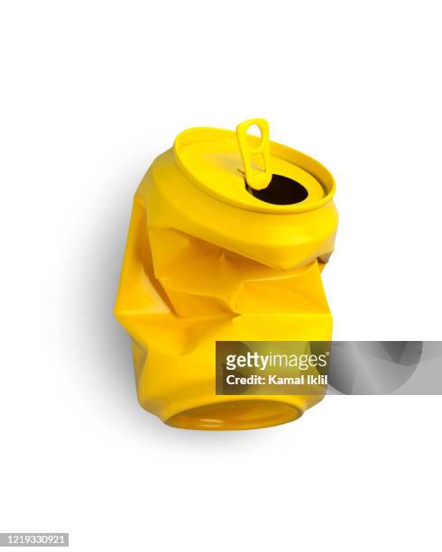 crushed yellow aluminium can. - crushed stock pictures, royalty-free photos & images