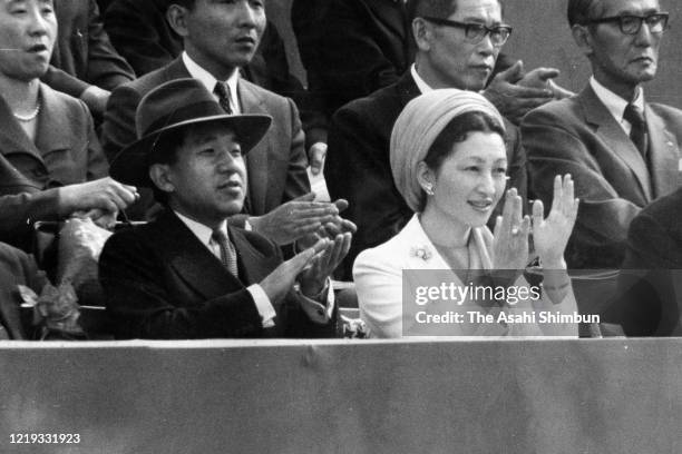 Crown Prince Akihito and Crown Princess Michiko watch on day one of the Davis Cup Eastern Inter-Zonal Final between Japan and India at the Den-En...