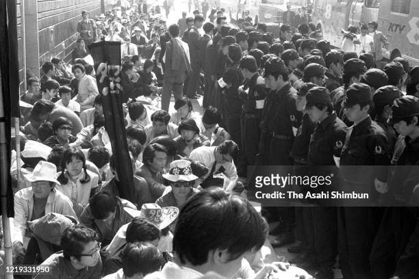 Minamata disease patients and supporters are blocked at the entrance of the Chisso shareholders meeting on May 26, 1971 in Osaka, Japan.