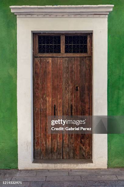 a spanish colonial door from oaxaca de juarez, mexico - spanish-colonial-architecture stock pictures, royalty-free photos & images