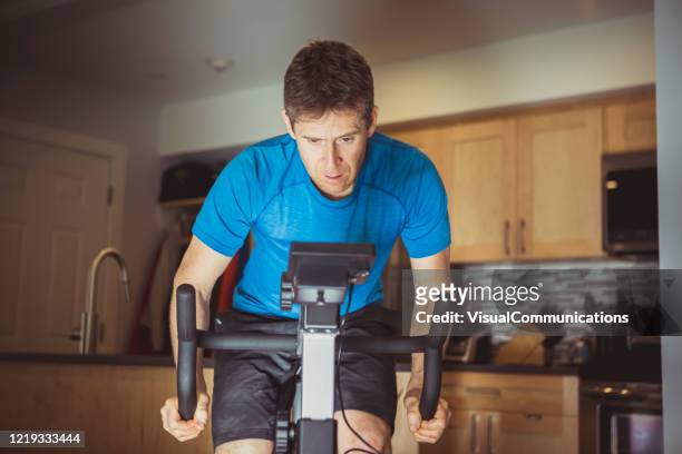 athlete staying at home, training during coronavirus pandemic. - staying indoors stock pictures, royalty-free photos & images