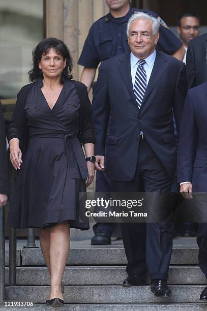 Former International Monetary Fund director Dominique Strauss-Kahn departs Manhattan State Supreme Court with his wife Anne Sinclair on August 23,...